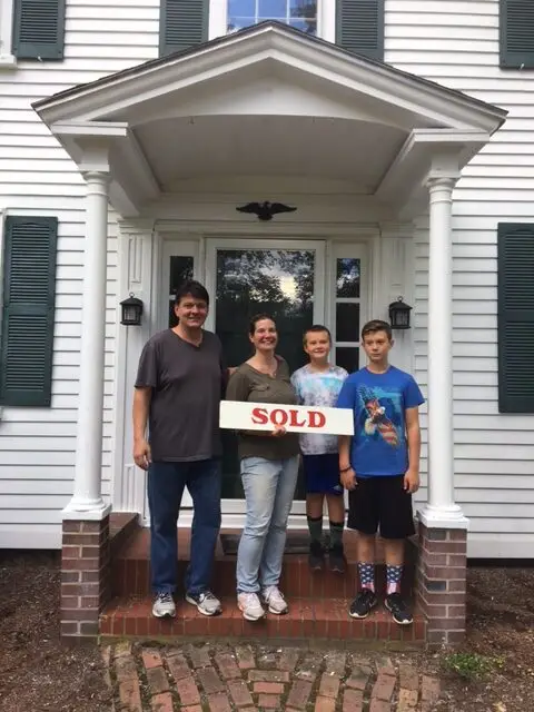 Family with a Sold Sign